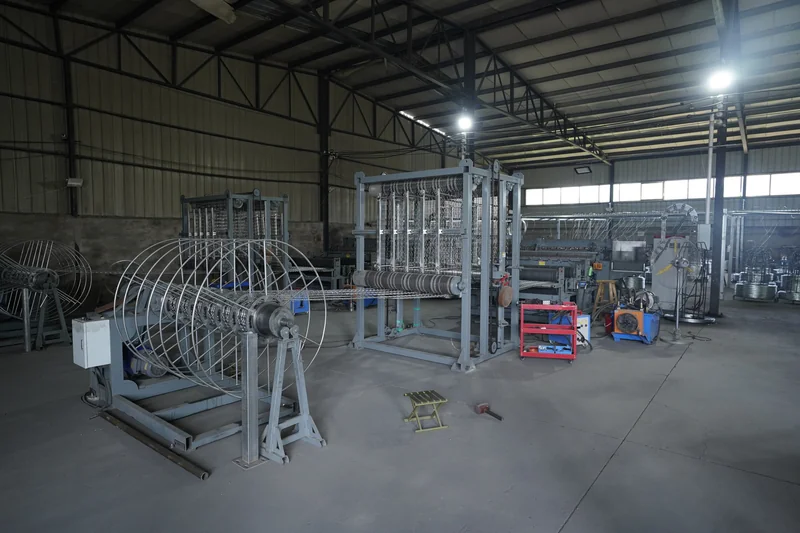 Workshop overview with mesh production and winding equipment